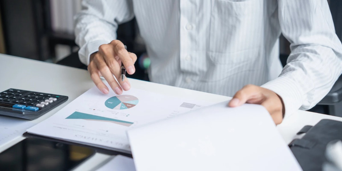Business professional reviewing financial reports for ESRD PPS compliance